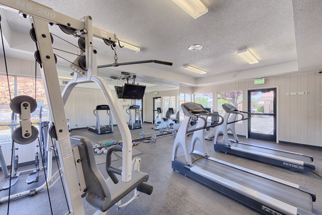 Well equipped fitness center with treadmills, weight machines and free weights. Large mirror from floor to ceiling to utilize while working out.