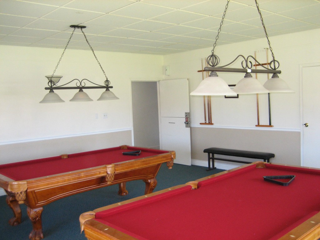 Community billiards room with two billiard tables for use by the residents to enjoy.