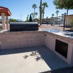 Large built in barbecue area with patio area and sink