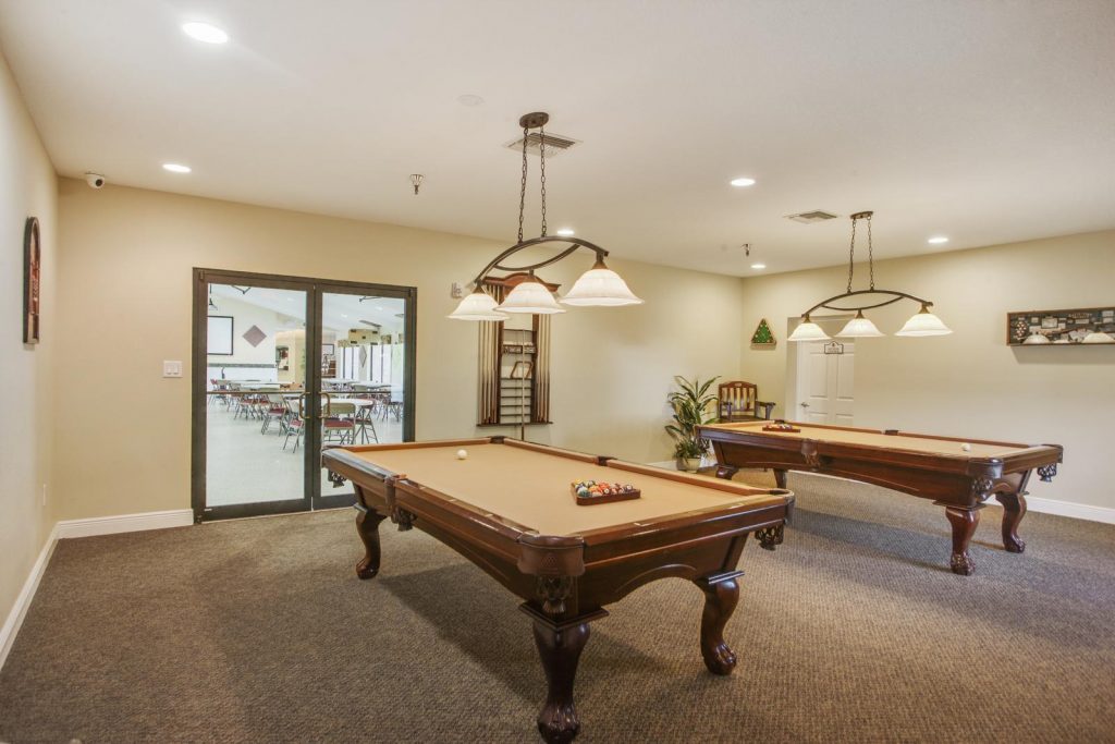 A game room with pool tables.