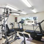 Brand, new fitness center with treadmills, weight machine and stationary bike.