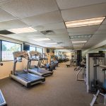 Fitness center has treadmills, stationary bikes and weight machines.