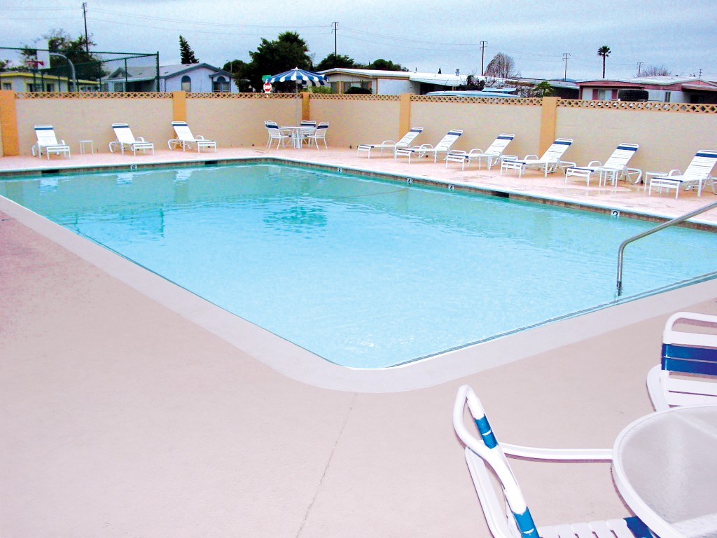 Outdoor heated pool opened to all residents year-round. Surrounded by lounge chairs for residents to sit and relax.