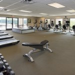 Large fitness room with free weights, treadmills, bikes, bench and stairmasters. Workout mat. Watercooler.