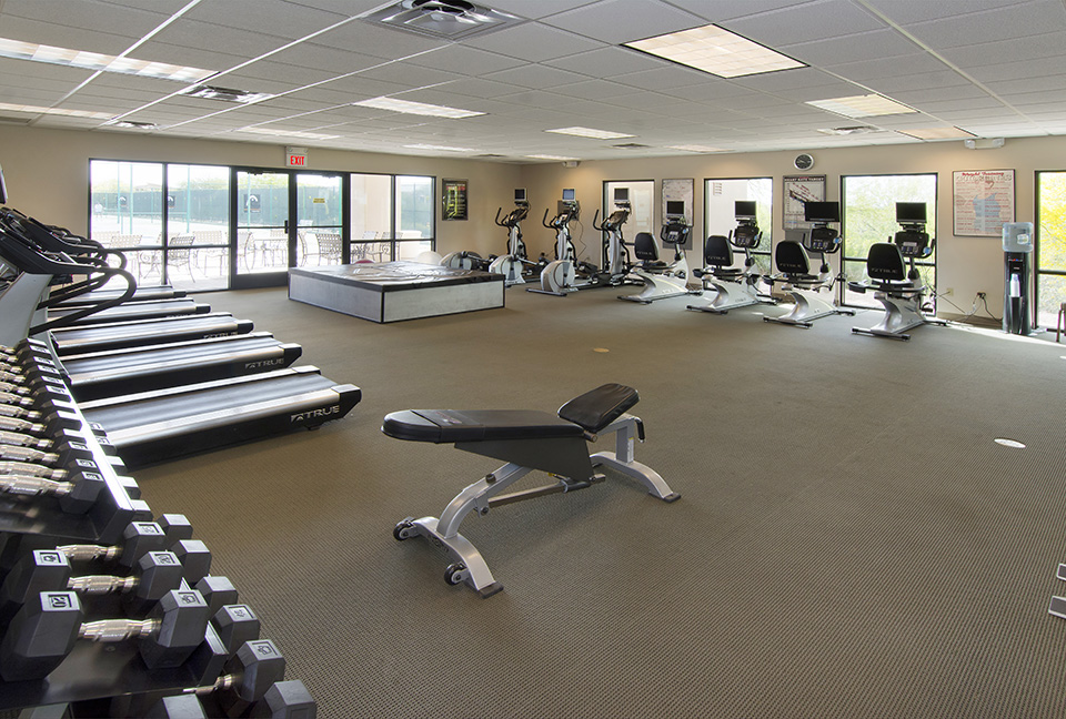 Large fitness room with free weights, treadmills, bikes, bench and stairmasters. Workout mat. Watercooler.