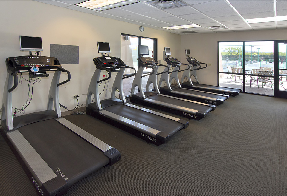 Fitness room with 5 treadmills that have own TV.