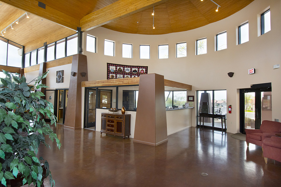 Community center with very high ceilings with Montesa at Gold Canyon offices side by side. Smooth floors.