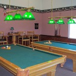 King Village, an all age manufactured home community has billiards room with two pool tables and seating.