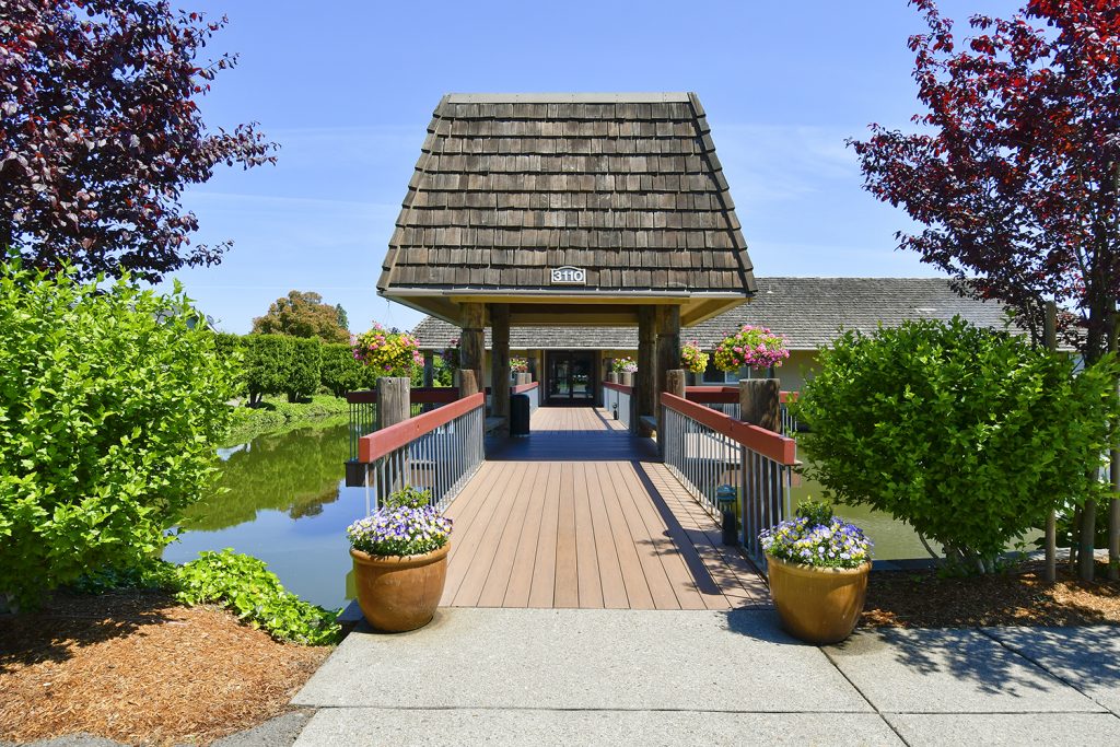 beautiful bridge over pound with covered gazebo. Leads to the main office and clubhouse.