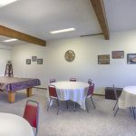 Community center equipped with billiard tables, multiple seating for community activities.