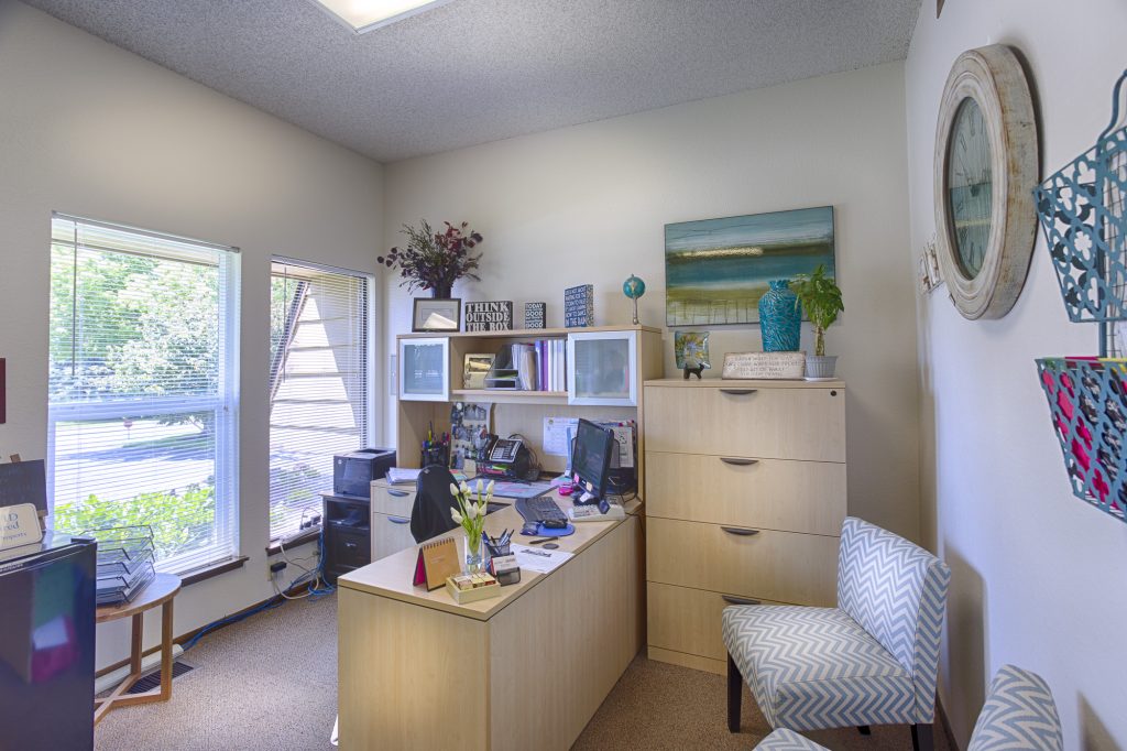 Front office full of natural light and light neutral colors throughout.