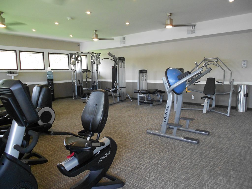 State of the art fitness center with stationary bikes and weight machines.